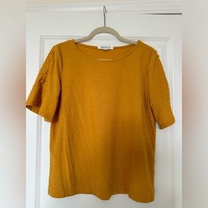 Yellow ruffled button sleeved top